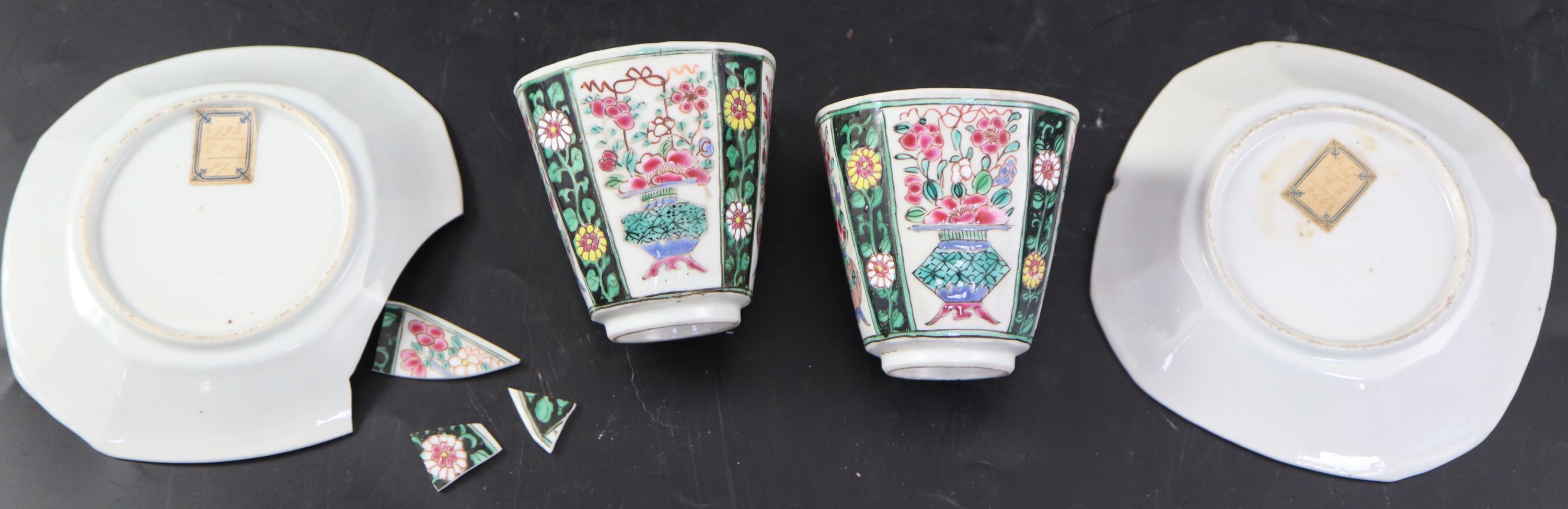 A pair of Chinese Qianlong famille rose octagonal cups and saucers, saucers 12cm cups height 6.5cm diameter 6.75cm